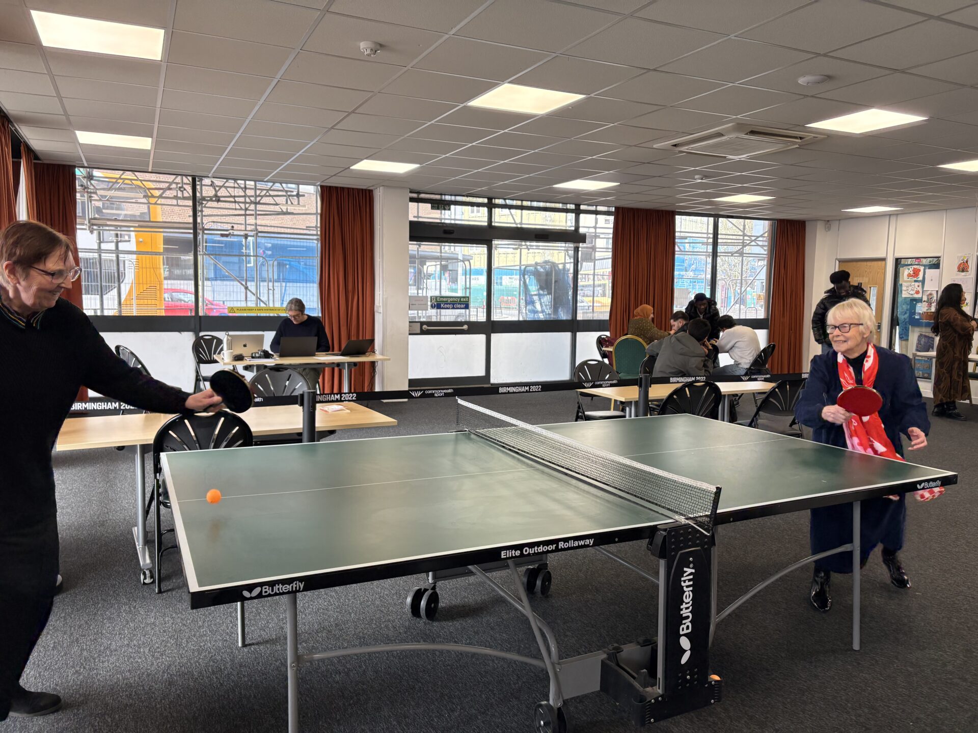 two women playing table tennis